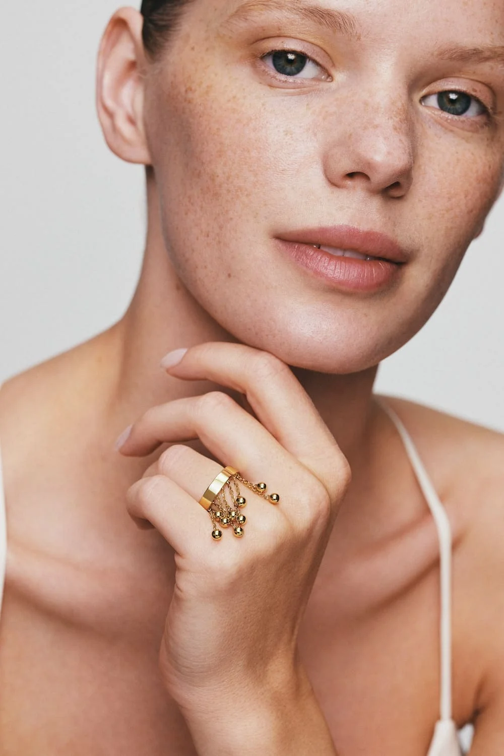 Rings Orbs Chainfall Ring, yellow gold available online with expert craftsmanship